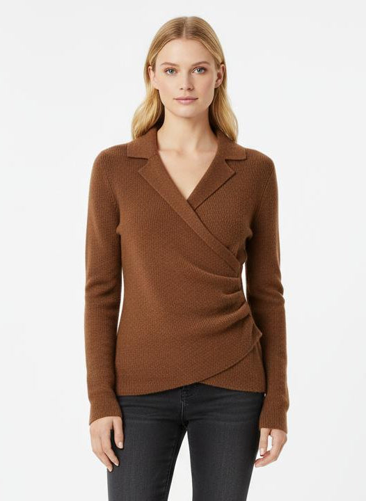 Woman wearing a brown wrap top and black pants on a white background