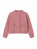 Pink knitted cardigan on a white background
