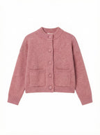 Pink knitted cardigan on a white background